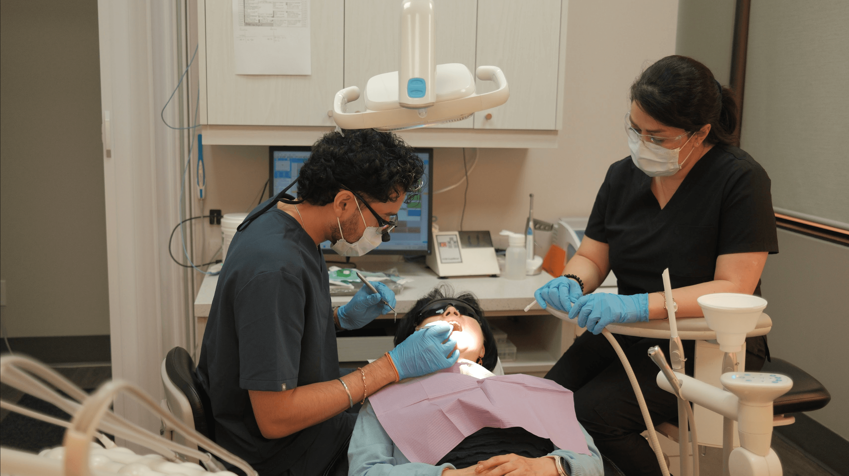 Dr. Ronit Sharma treating a patient chairside